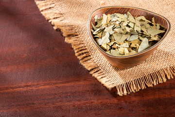 Laurus nobilis - Crushed bay leaves. Text space