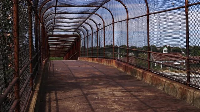 Man walks across Anacostia Bridge 295