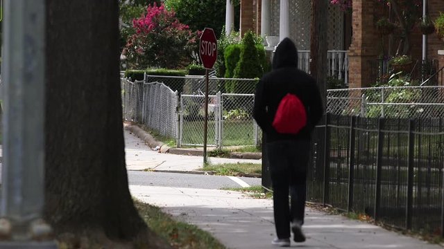 Man Walks in Anacostia Neighborhood