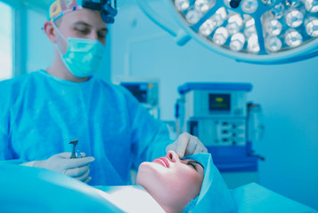 Man surgeon at work in operating room