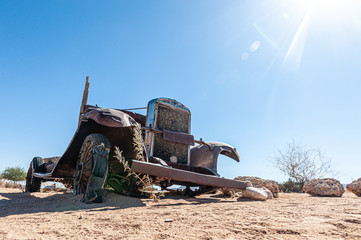Wrecks of historic cars line the road in the town of Solitaire in the Khomas Region of Namibia.