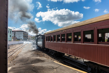 Train at the station waiting for passengers - former steam locomotive in Minas Gerais, train ride between the cities of Tiradentes and Sao Joao del Rei