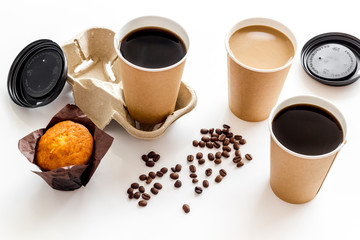 Obraz na płótnie Canvas Coffee to go with muffin on white background