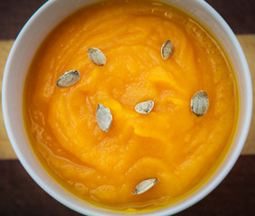 Delicious pumpkin cream soup with pumpkin seeds.