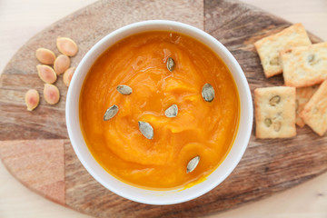 Delicious pumpkin cream soup with pumpkin seeds.