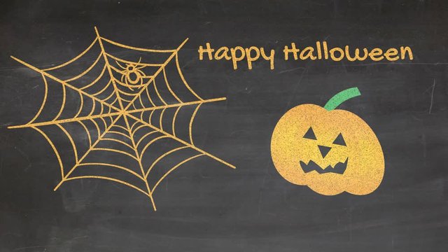 Happy Halloween illustrated with spider web and carved pumpkin on blackboard.