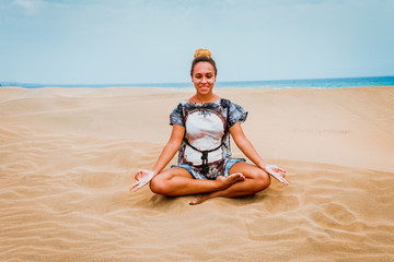 Girl doing yoga in the desert - Gran Canaria dunes