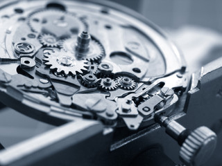 close up of wintage watch mechanism small gears