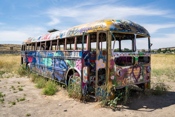 Washtucna, Washington -  Famous Pacific Northwest icon known as That PNW bus is an old abandoned school bus in a field alongside highway 260