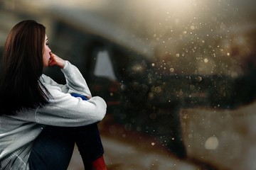 Young woman crying on background