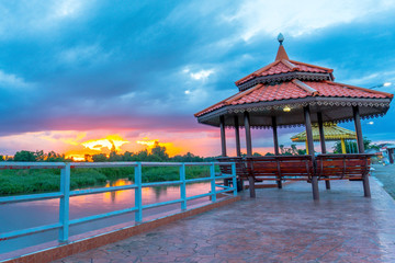 the beautiful .pavilion near the river with the beautiful sunset on the evening