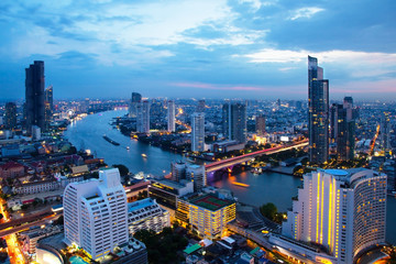 Bangkok skyline metropolis Cityscape downtown with Chao Phraya River in evening night in Thailand Asia  