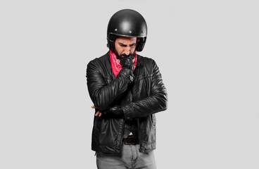 motorbike rider thinking  or doubting