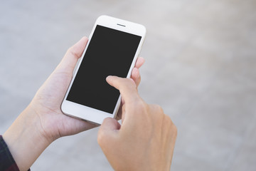 Woman using smart phone with blank screen