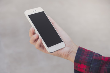 Woman using smart phone with blank screen