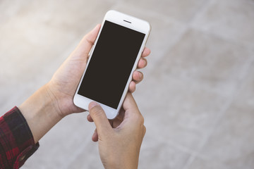 Woman using smart phone with blank screen