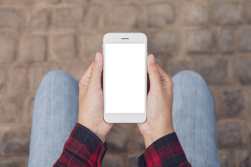 Women hands holding smart phone with blank screen sitting outdoor