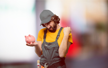 handyman worker  with a piggy bank