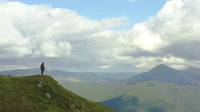 The man standing on a mountain with a beautiful view