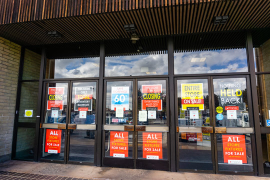 February 28, 2019 Sunnyvale / CA / USA - Exterior view of a Macy's store about to close; signs advertising high discounts placed on the entrance doors