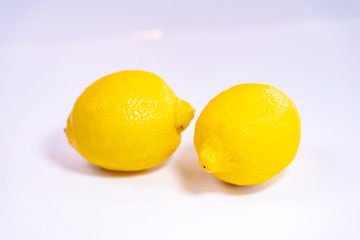 freshCreative layout made of lemon and leaves. Flat lay. Food concept. Lemon on white background