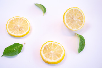Creative layout made of lemon and leaves. Flat lay. Food concept. Lemon on white background