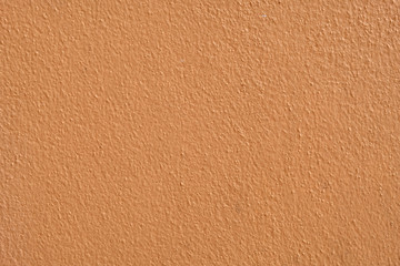 Brown cement wall background close up