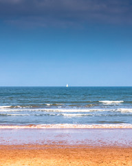 Seaside beach coastal with water and waves in Cornwall, England.
