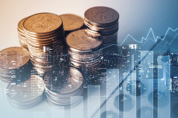 Double exposure of graph , stationary  and rows of coins for goal office ,  finance and business...