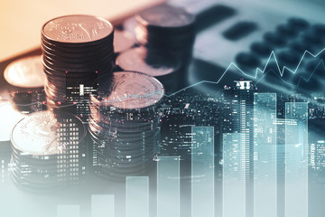 Double exposure of graph , stationary  and rows of coins for goal office ,  finance and business...