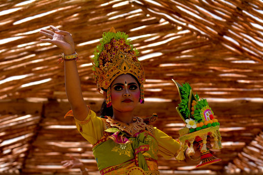 Balinese woman dancing Tari Pendet Dance in Bali Indonesia
