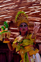 Fototapeta na wymiar Balinese woman dancing Tari Pendet Dance in Bali Indonesia
