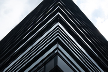 Fototapeta na wymiar Modern Office Building in Tokyo. Straight lines in Structure.