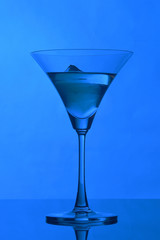 martini glass on backlight background
