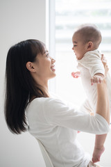 Young mother holding her baby