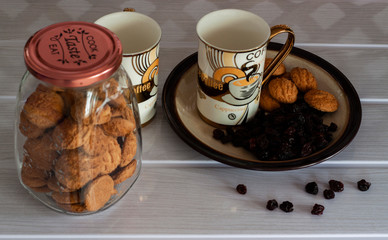 Glasses of coffee and cookies with raisins top view