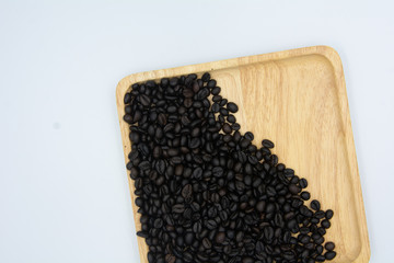 Roasted coffee beans on wooden plates