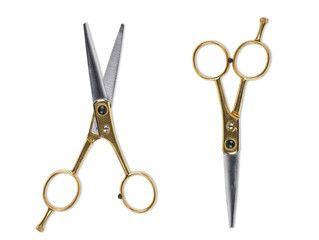 Top view of vintage gold and silver scissors isolated on white