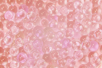 Abstract texture of transparent glass balls with pink ink or lump of marbles. Collagen Hydrolysate....