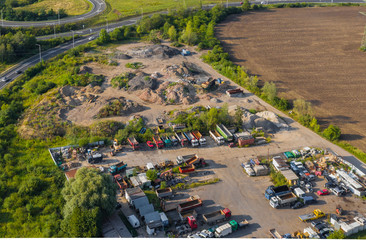 Aerial View of Trucks and Vehicle Parking Near Landfill.