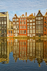 Fototapeta na wymiar Amsterdam old houses reflection in river Amstel
