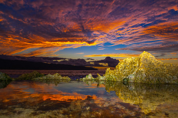 Amazing North Shore Oahu sunset reflected in a tide pool