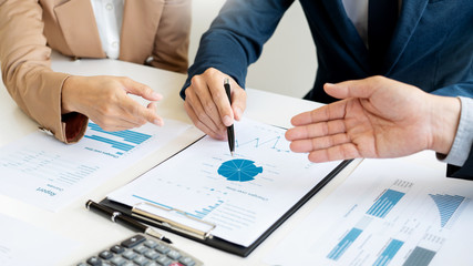 Business People Talking Discussing with coworker planning analyzing financial document data charts and graphs in Meeting and  successful teamwork Concept.