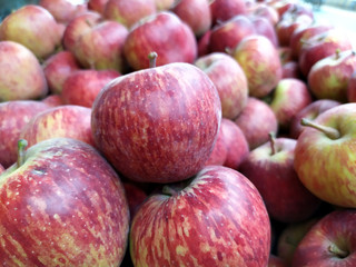 fresh beautiful healthy red apple on the street