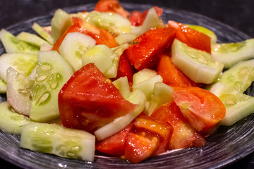 cucumber and tomato salad with olive oil.