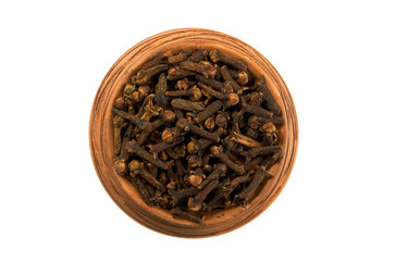 Dry cloves in glossy cup isolated on white background. View from above. Seasoning on isolate. Dry spices.