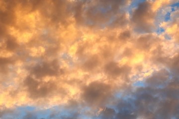 Colourful Sunset sky for nature background - orange and blue dramatic colorful clouds