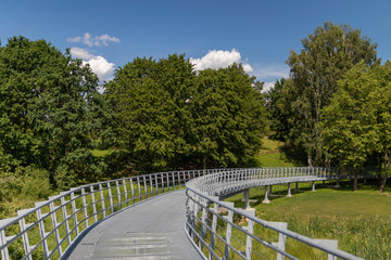 metal air bridge walks across the meadow