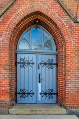 old wooden church door with hinges