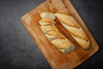 Frensh bread on wooden chopping board